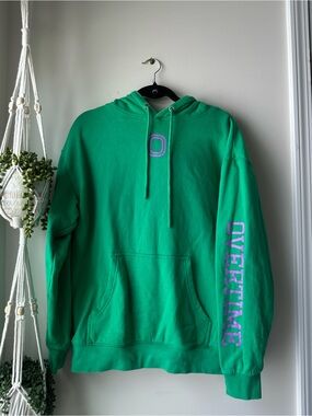 Green Crewneck Hoodie with Purple 'OVERTIME' Sleeve Text